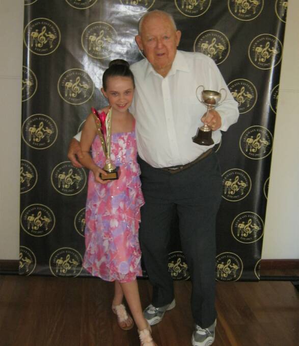 PROUD: Abbi-Lea Robinson and her great-grandfather Ken Victor have both won trophies for singing in the Abermain Eisteddfod.