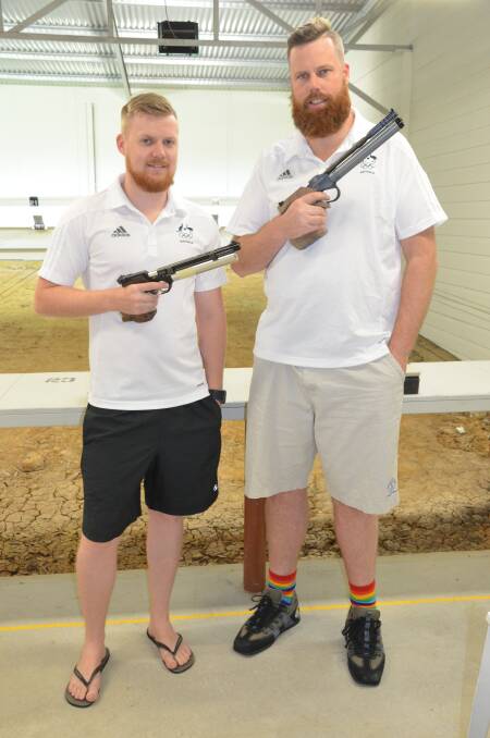 VETERAN GUN: This will be the fourth and final Olympics for "Big Dan" Repacholi, pictured right with Blackburn, and the 34-year-old shooter wants to go out with a bang. 