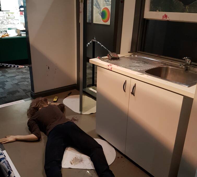 The recreated crime scene at the police museum, with clues.