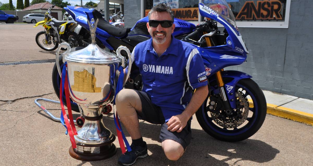 WINNER: Wallaby Gully rider Simon Galloway with his trophy from the Australasian Superbike Championship Formula Oz.