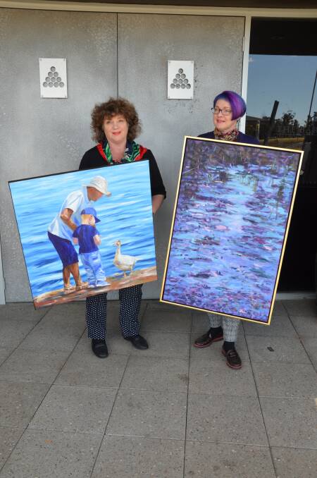 CREATIVE: Artists Katrina Rose and Janine Matthews with their respective works Lakeview 9 and Twilight Dam, which will feature in the Spring Art Fair.