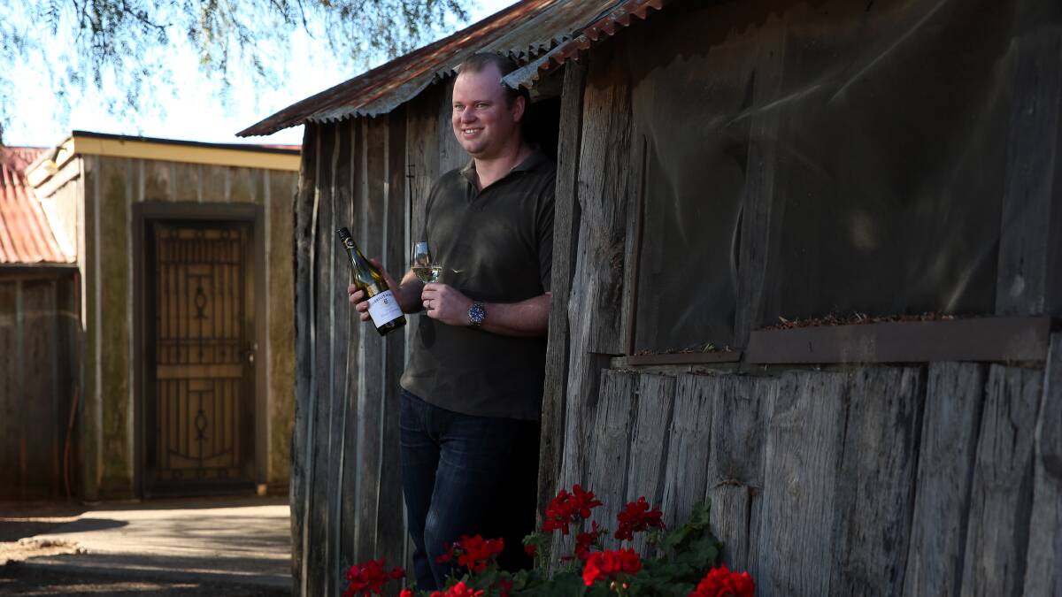 HAT TRICK: Chris Tyrrell with the award-winning Vat 47 chardonnay, rated the state's top wine. Picture Simon De Peak.