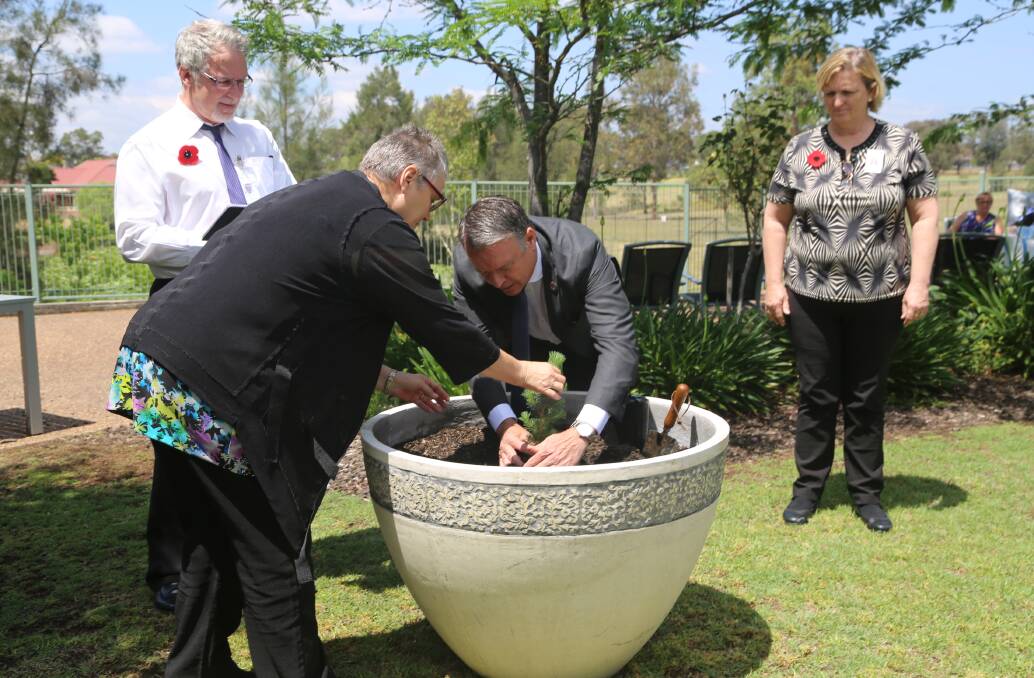 REMEMBRANCE DAY: Planting the lone pin at Calvary in honour of Bert Ferres, a recently passed resident who was also a Rat of Tobruk.