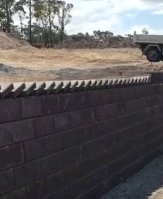 PERFECT: The pavers were placed at precise distances apart as they fell on top of each other on the 33-metre retaining wall. Watch the video - www.theherald.com.au