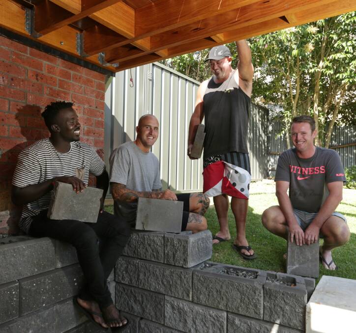 STARS: Landscapers Deng Amourr, Kye Nelson, Rhett Jones and Nick Davies have become internet sensations with their domino pavers. Picture: Simone De Peak.