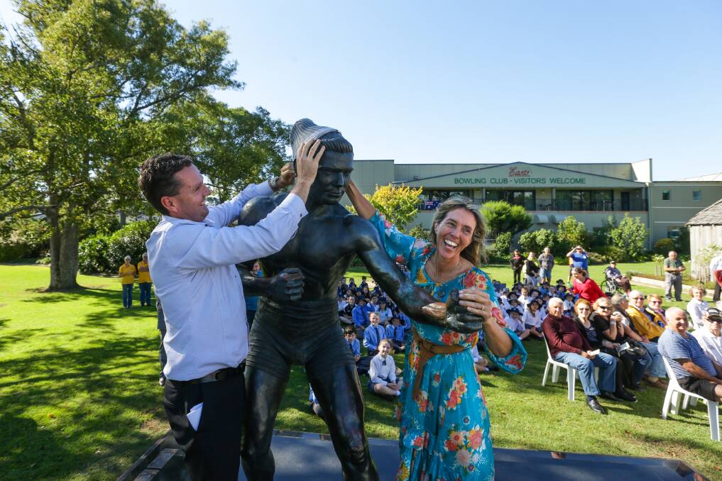 CHAMPIONS: Mark Hughes and Tanya Bartlett fit a beanie on Darcy's statue. Pictures: Jonathan Carroll