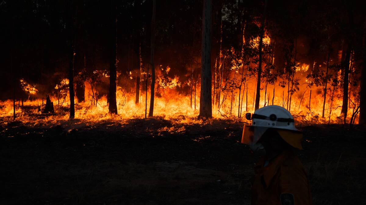INFERNO: Firefighters battle intense bushfires at Richmond Vale and Black Hill on Wednesday. Pictures: Max Mason-Hubers, Sage Swinton, MJF Productions