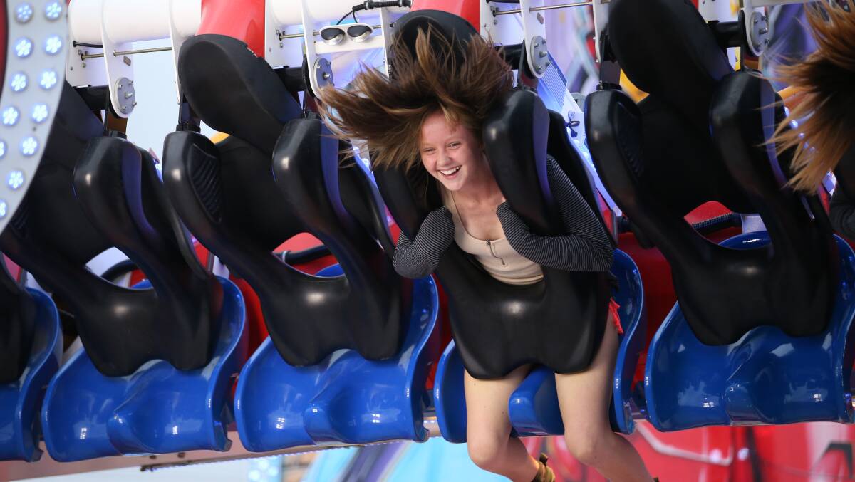 ADRENALINE: Kayla Hedges of Kurri Kurri breaks out a big smile while riding the Avenger at the Cessnock Show. Picture: Max Mason Hubers