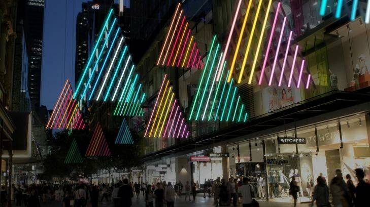 An artist's impression of the 25 Christmas forest lights in Sydney's Pitt Street Mall. Passersby can use a smartphone app to change the colours of the trees. 