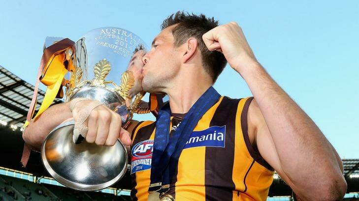 Luke Hodge of the Hawks  kisses the Premeirship Cup during the 2014 AFL Grand Final match. Photo: Quinn Rooney