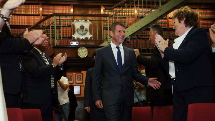 Congratulations from the party room for NSW Premier Mike Baird as the newly elected MPs were introduced.. Photo: Kate Geraghty