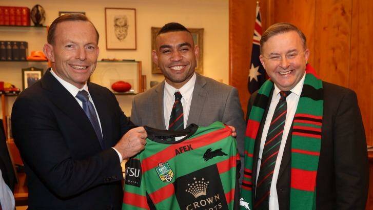 Prime Minister Tony Abbott being presented with a South Sydney jersey by Nathan Merritt and Labor MP Anthony Albanese. Photo: Andrew Meares