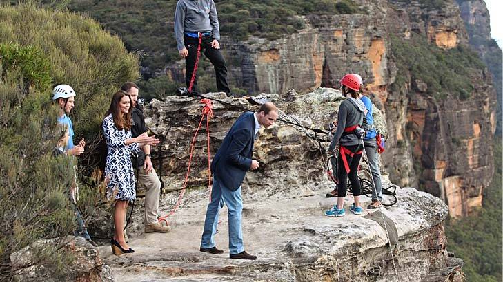 Long drop: The Duke and Duchess of Cambridge watch abseilers at Narrow Neck Lookout. Photo: Wolter Peeters