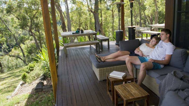 Ethan Harley and and Alex Mackenzie of  Sydney, enjoy the relaxed settings of The Escape luxury camping. Photo: Jay Cronan