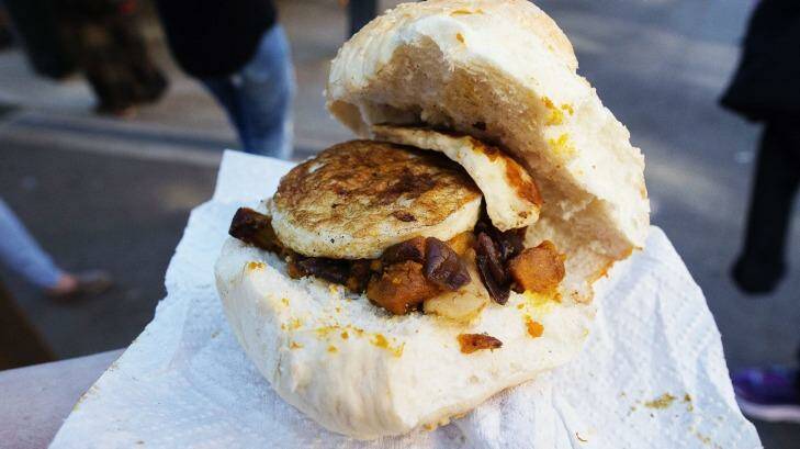 A gourmet egg and haloumi roll at Erskineville Public School on Saturday. Photo: Christopher Pearce
