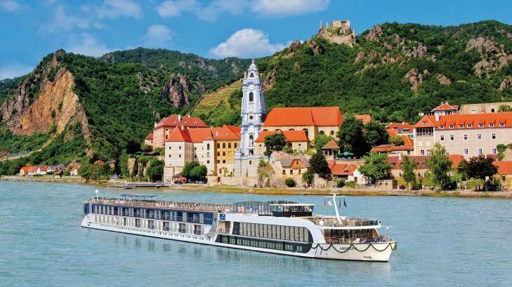 See Europe by river. Here, an APT ship cruises past Durnstein on the Austrian Danube. Photo: APT