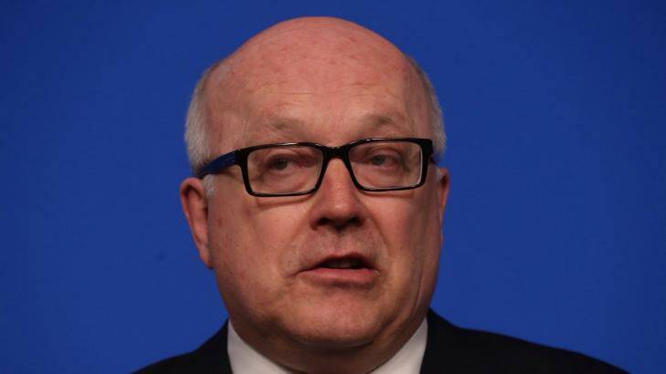 George Brandis says new national security laws won't target journalists but his department says they will if the journalists are "reckless". Photo: Andrew Meares