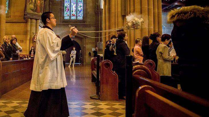 The mass at St Mary's Cathedral was a solemn affair. Photo: Michele Mossop