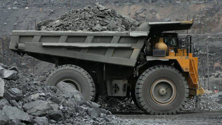 A truck carries excavated iron ore from the open pit of the Lebedinsky GOK (LGOK) iron ore mining and processing plant, operated by Metalloinvest?? Holding Co., in Gubkin, Russia, July 13, 2017. The new hot briquetted iron (HBI) production line at the Lebedinsky mine in Russia has an output capacity of 1.8m tons per year, a spokeswoman said by phone. Photographer: Andrey Rudakov/Bloomberg