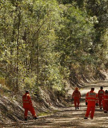 SES volunteers and NSW police search the Middle Brother Forest approximately 12km from Kendall. Photo: Kate Geraghty