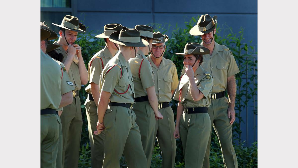 WODONGA: Private Caitlin Richmond shares a joke with her RAAOC colleagues prior to the march. Photo: The Border Mail. 