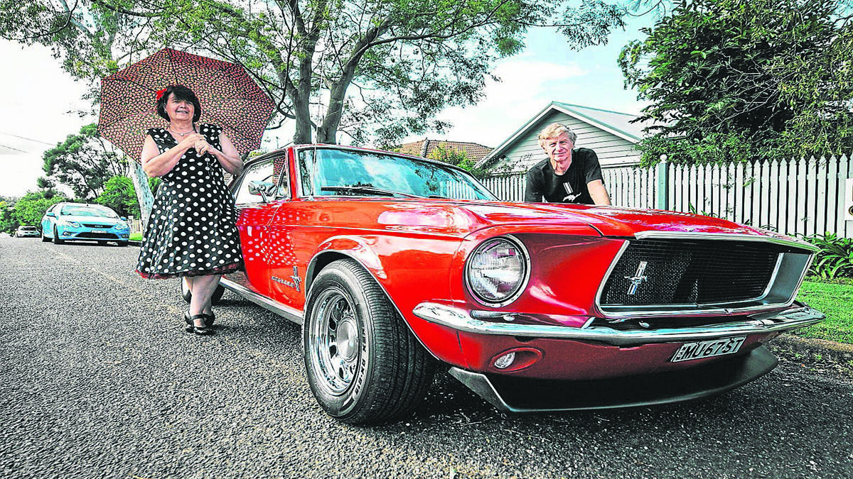 PRIDE AND JOY: Sue Wilson and Kevin Richard with their prized 1967 Ford Mustang, one of 20 that will pass through town on Sunday.