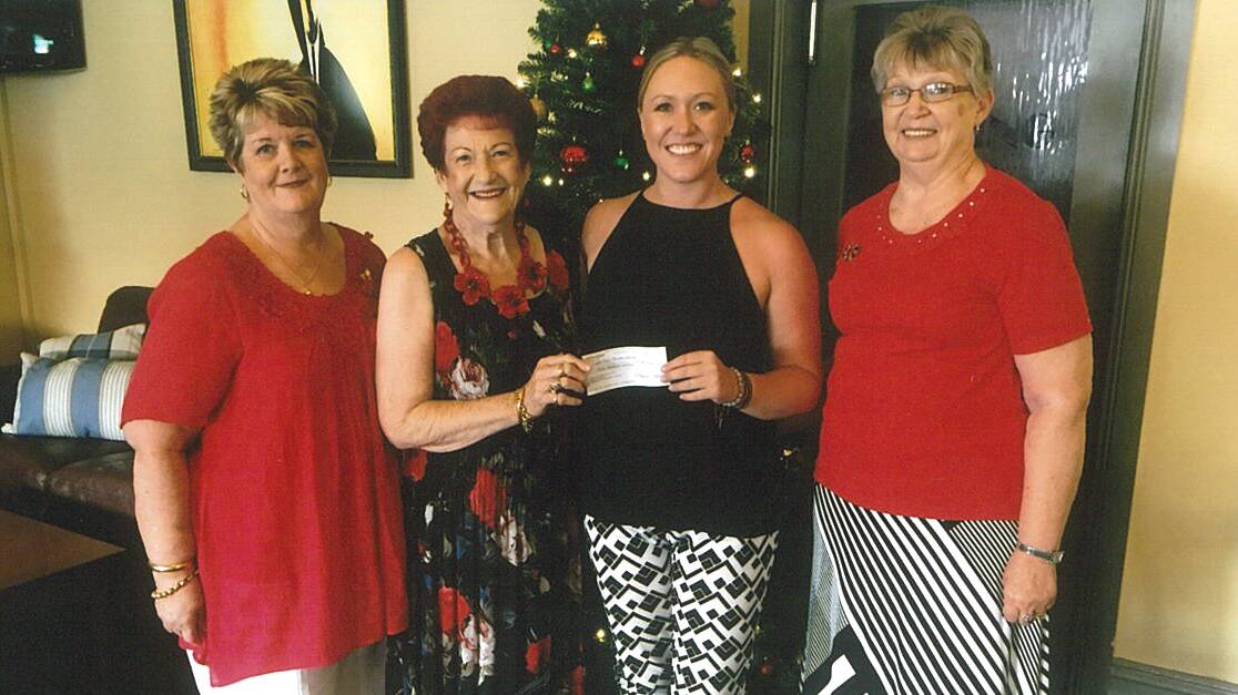 Westpac Rescue Helicopter Service’s Cessnock Volunteer Support Group members Betty Cordowiner, Patsy Black and Lorainne Corcoran delivering their latest contribution to Westpac Helicopter coordinator Jacquie Bailey.