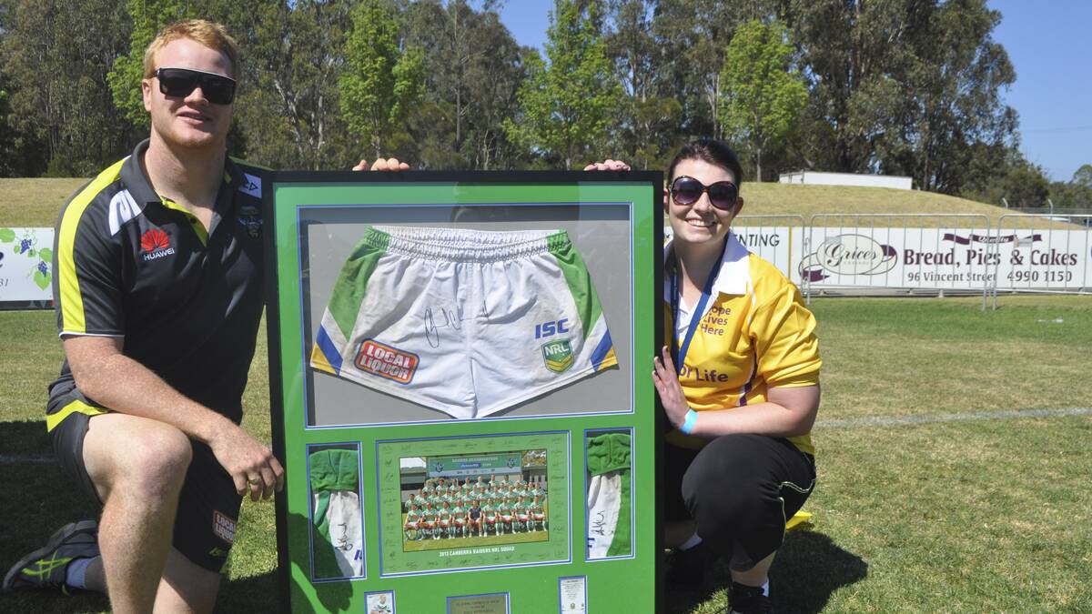 GIVING BACK: Joel Edwards (pictured with Advertiser manager Rebecca Gillon at the Cessnock Relay For Life) has been nominated for the NRL One Community Awards Ken Stephen Medal for his community work.