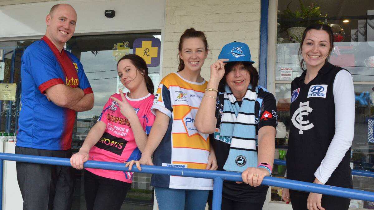 TEAM PRIDE: Lee Grundy, Telese Summerville, Annabelle Lambert, Lorraine Tiko and Naomi McCann of Branxton Pharmacy in their favourite teams' colours for Footy Colours Day.