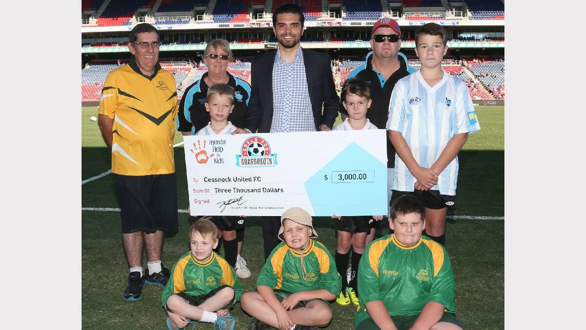 PROUD: Accepting the Goals for Grassroots cheque is, (back row) Cessnock United Football Club’s Troy Crosdale, Ann Skinner, Geremia Tassone representing Hyundai and Scott Parkes with club members (middle) Rory Short, Harry Sherring, Will Parkes and (front) Special Olympics players Ethan Metz, Joshua Henry and Ayden Crosdale. 