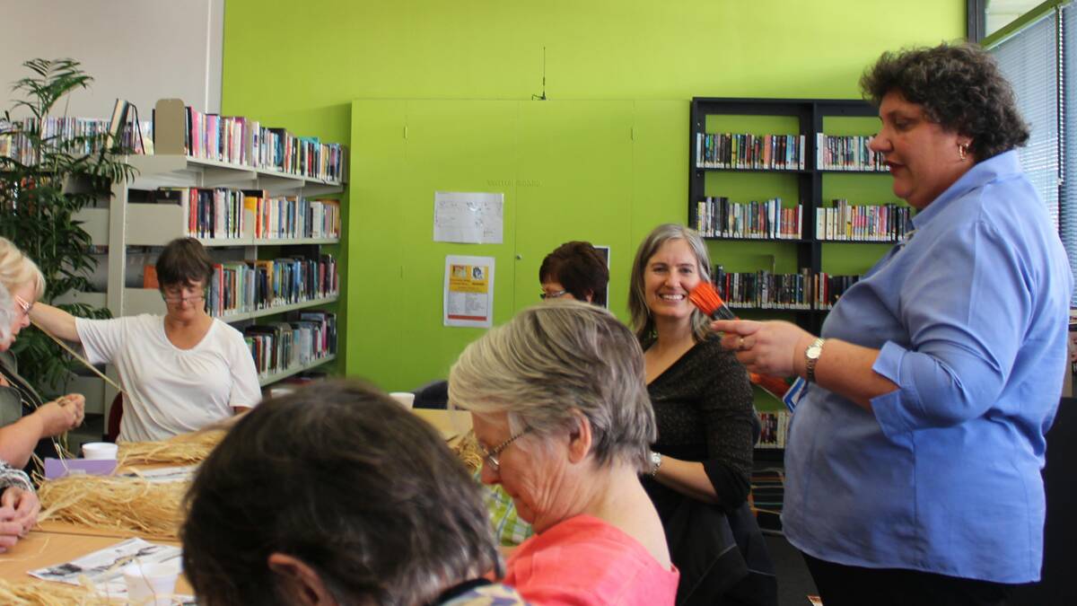 CREATIVE: Michelle Earl and some of the participants from a basket weaving workshop at Cessnock City Library.
