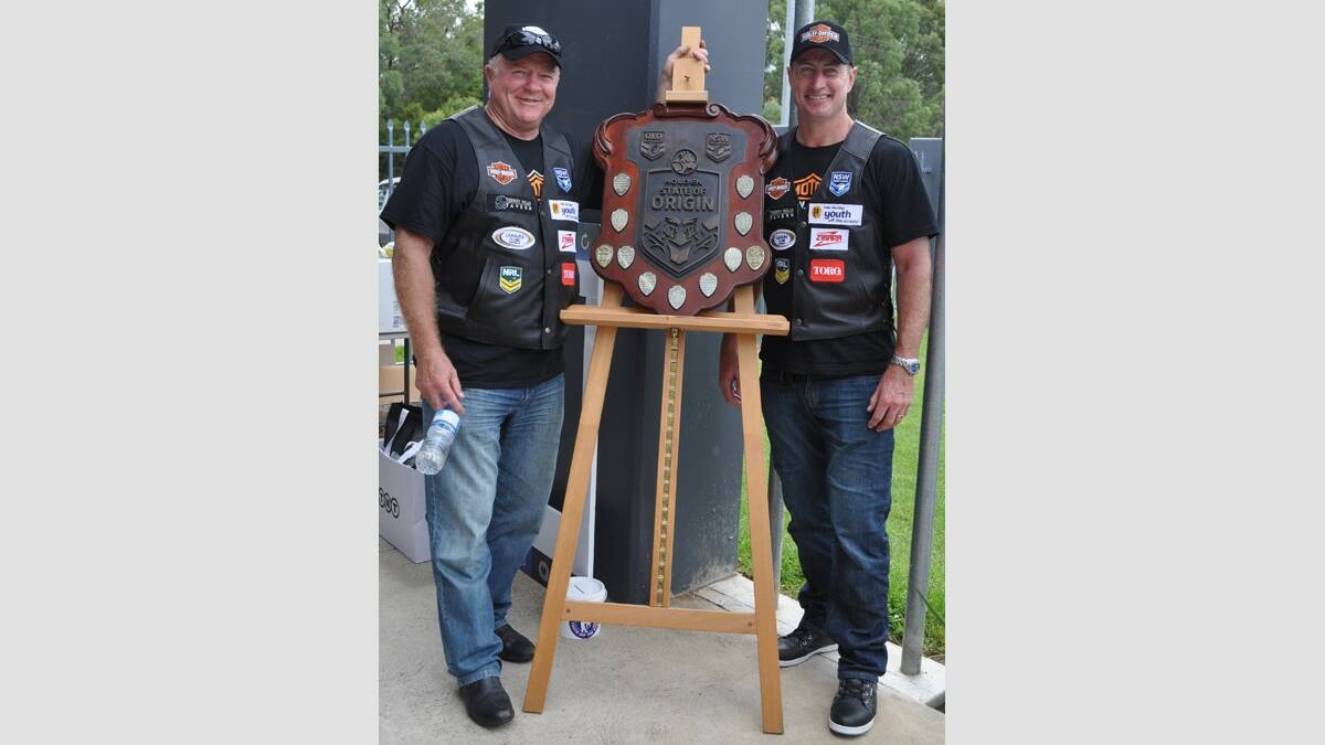 STATE PRIDE: Ian Schubert and Steve Menzies with the State of Origin Trophy at Cessnock Sportsground.
