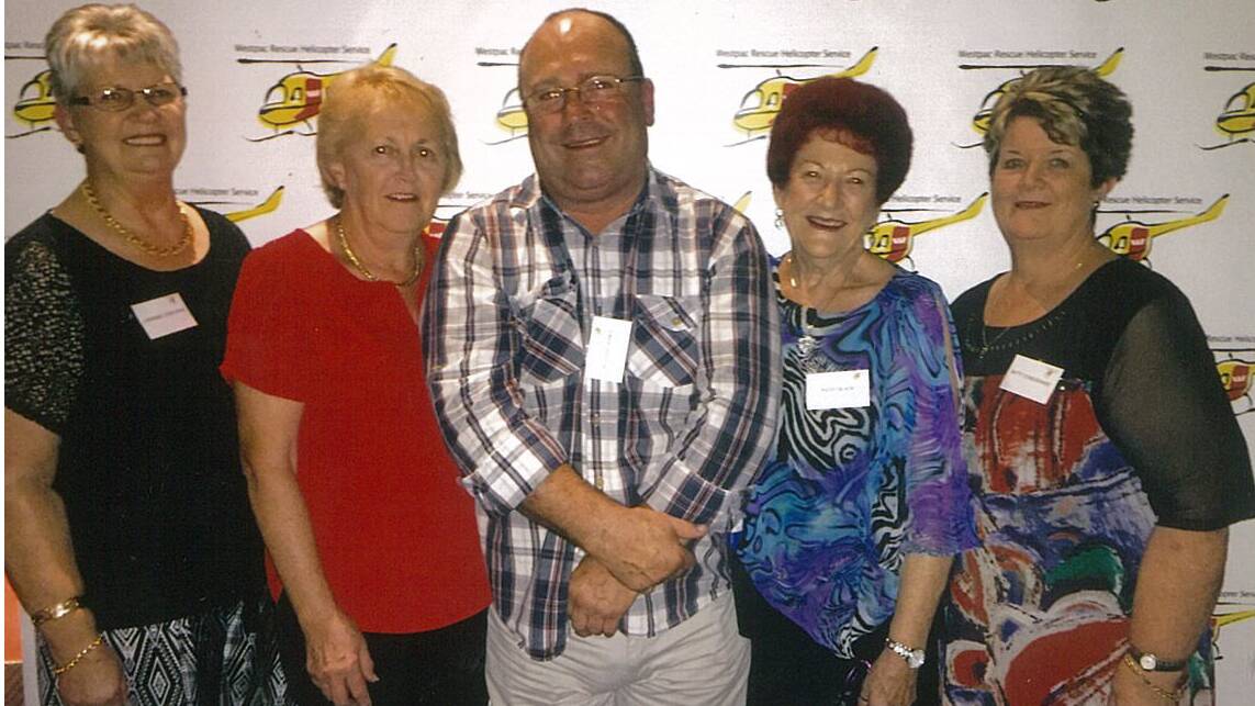 Westpac Rescue Helicopter Service’s Cessnock Volunteer Support Group volunteers Lorainne Corcoran, Lynne Naysmith, Patsy Black and Betty Cordowiner with Helicopter service general manager Richard Jones at the 40th anniversary celebration.