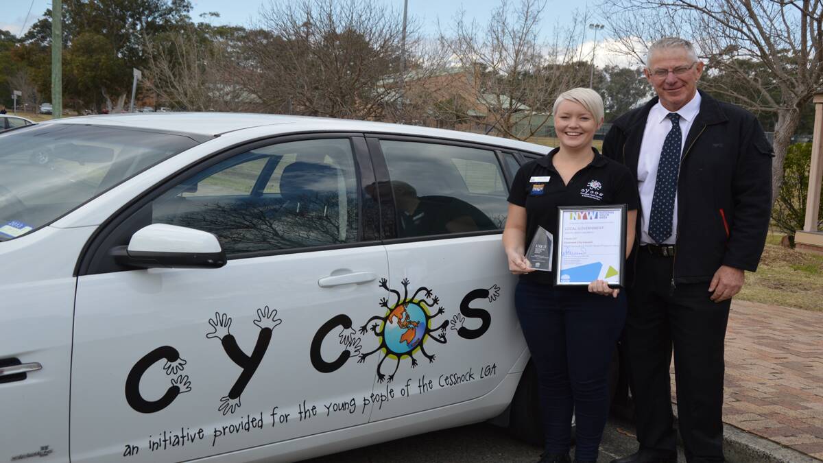 WIN FOR YOUTH: Cessnock City Council’s CYCOS coordinator Emily Cant and Cessnock Mayor Bob Pynsent with the NSW Local Government Week award.