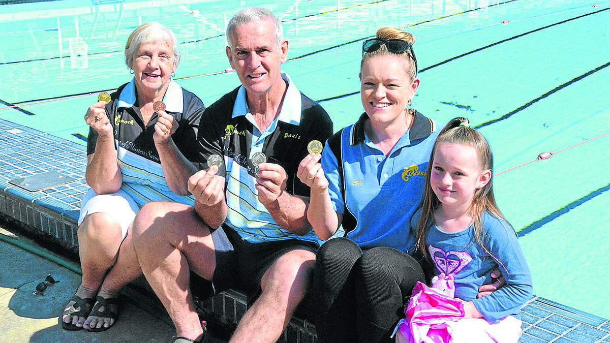 OUTSTANDING: Cessnock Masters swimmers Pat McCarthy, Dennis Moore and Erin Cole (and Erin’s daughter Jasmine) with their medals from the Masters Swimming NSW Long Distance Championships.