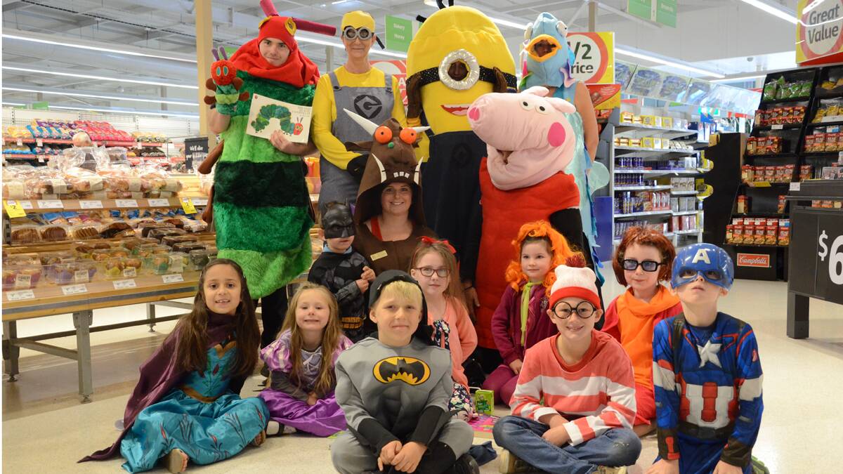 DRESS UP: Pictured at back, Coles Kurri staff Lachlan Thompson, Gwenda Scoles, Bec Scoles, Pauline Mason and Peta Glenton, and at front, Stanford Merthyr Infants School students  and teacher Jodie Petersen.