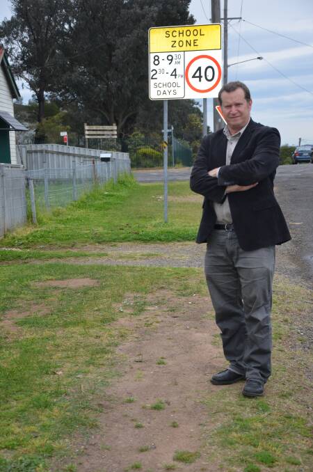 SAFETY CONCERNS: Cr. James Ryan in Deakin Street, Kurri, where he says a footpath is urgently required.