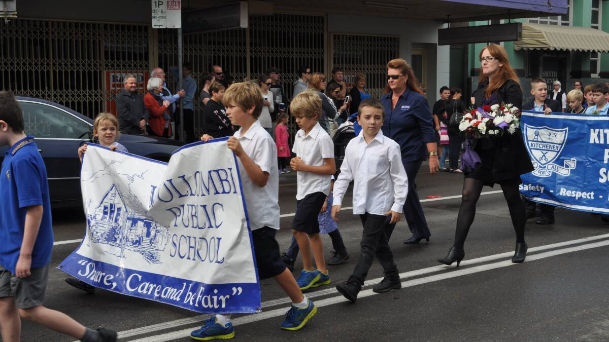 The Cessnock Anzac Day march proceeds down Vincent Street.