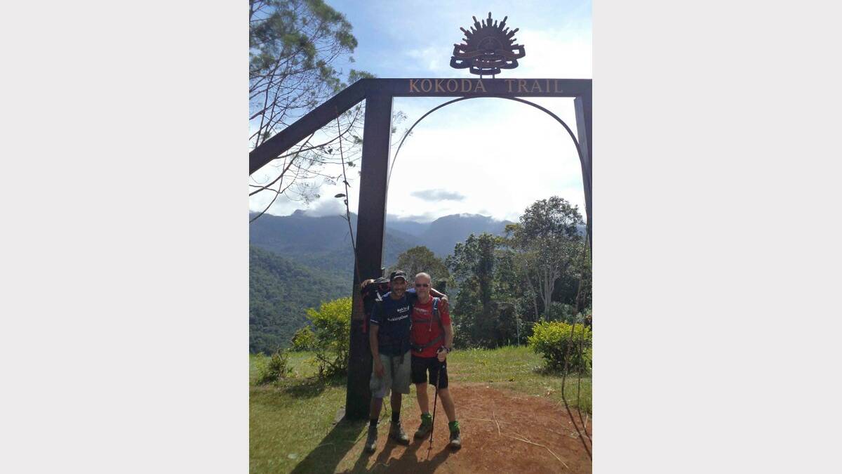 HUGE EFFORT: Ian Olsen (right) and his porter Martin on the Kokoda trail in 2013