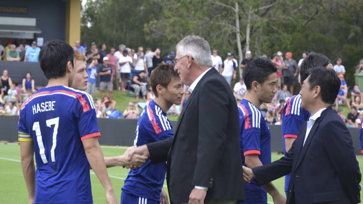 WELCOME: Cessnock Mayor, Cr. Bob Pynsent and Acting Consulate-General of Japan, Mr. Katsutoshi Miyakawa greet the Japanese team before the game on Sunday.