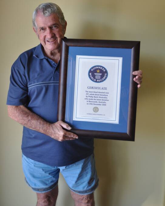 GOOD FEELING: Phil Baird with his Guinness World Record certificate after setting the record for most whole blood donations in 2009.