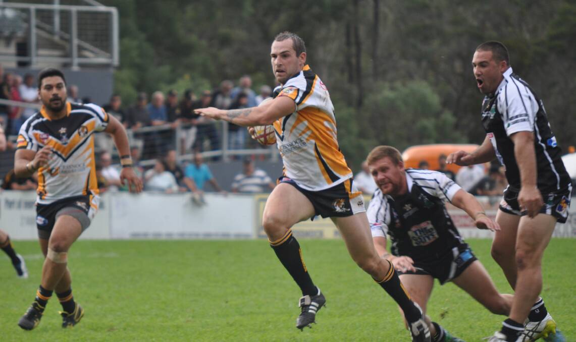 BUST: Cessnock’s Brendan Hlad on his way to scoring his second try in Saturday’s clash with Maitland.