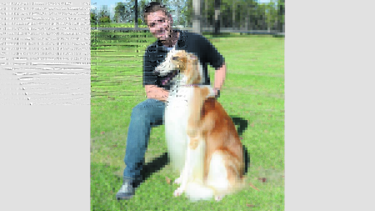 TITLE CHANCE: Shannon Barden of Bishops Bridge and his Borzoi, Murphy, have qualified for the Best in Hound competition at the Sydney Royal Dog Show.