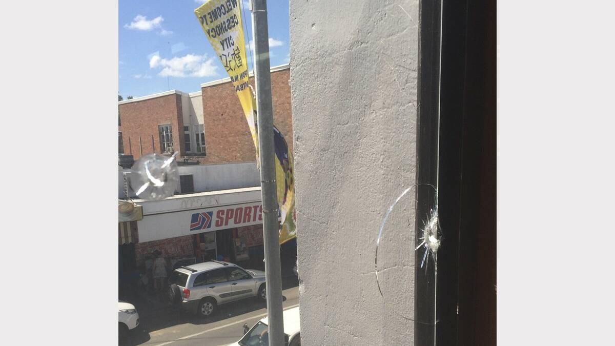 DANGER: The hole in the window of a Vincent Street business where a ball bearing projectile was found by staff
