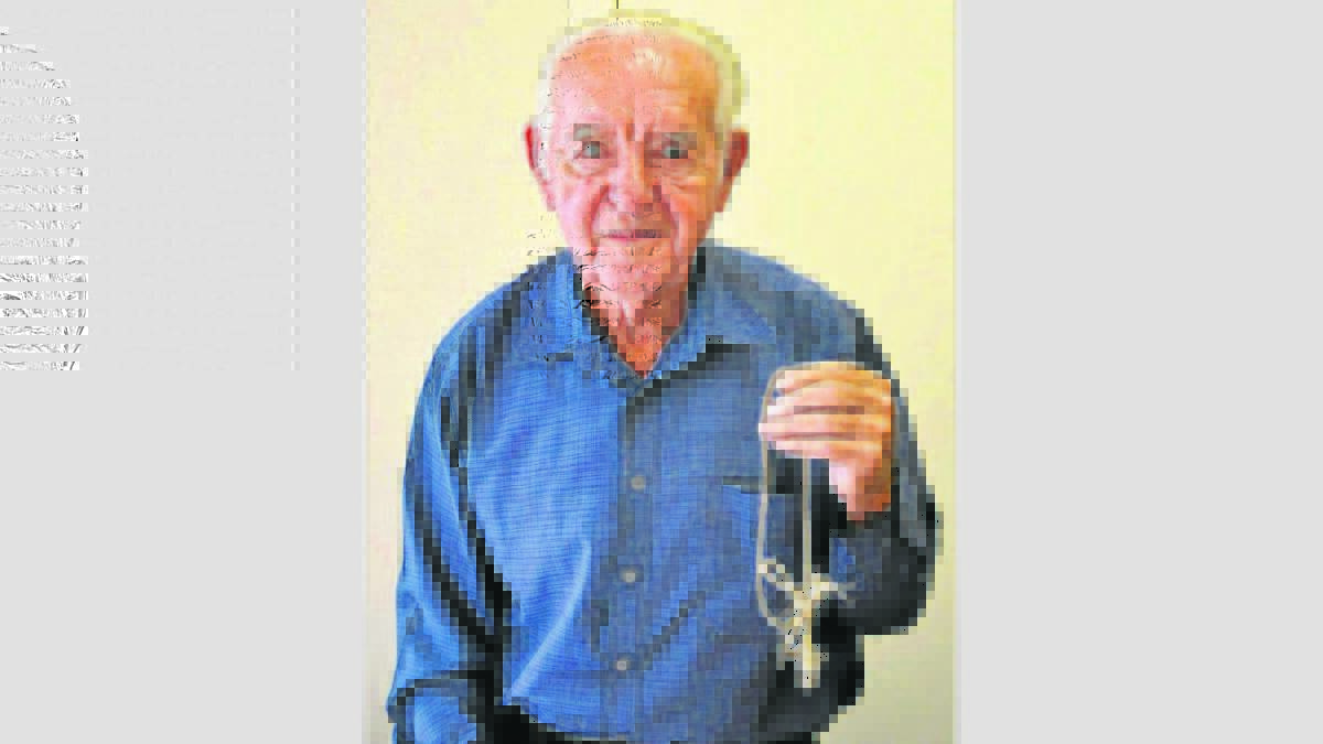 MEMENTO: Robert Groves with his piece of rope from a parachute on the ill-fated DC-3.