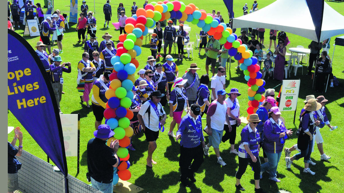 CELEBRATION: The survivors and carers lap at the 2015 Cessnock Relay For Life.