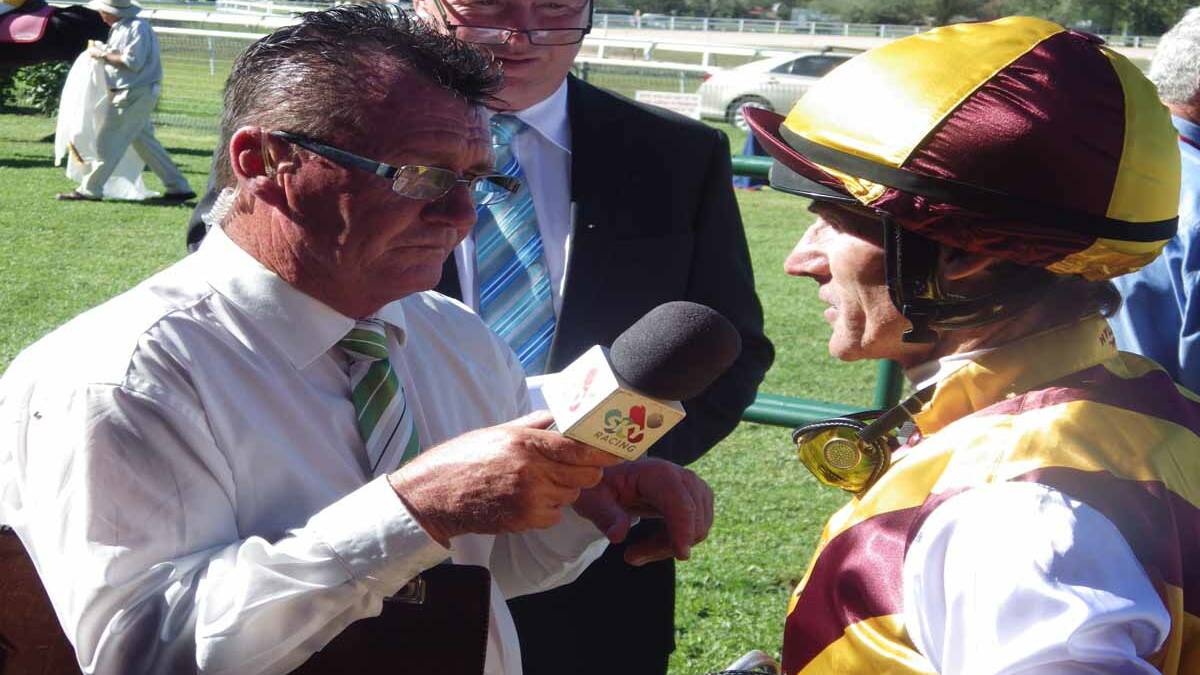 WIN NUMBER THREE: Sky Channel form expert Garry Kliese interviews Robert Thompson after his win on Tableaux, trained at Cessnock by Todd Howlett. The win was Thompson’s third for the day.