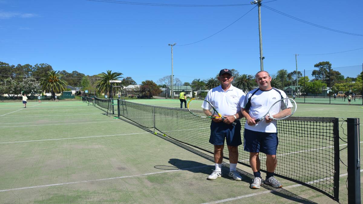BRINGING IT BACK: Col Andrews and Paul Campbell at Kurri tennis courts, where Friday night family tennis starts again this week.