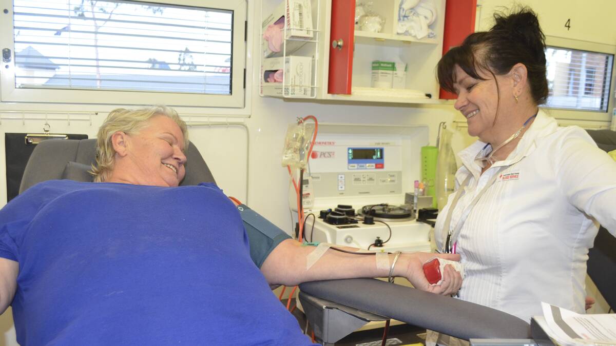 GOOD FEELING: Blood and plasma donor Nancy Wratten and registered nurse Narelle Davies at the Australian Red Cross Blood Service’s Hunter mobile service at Cessnock Plaza on Monday.