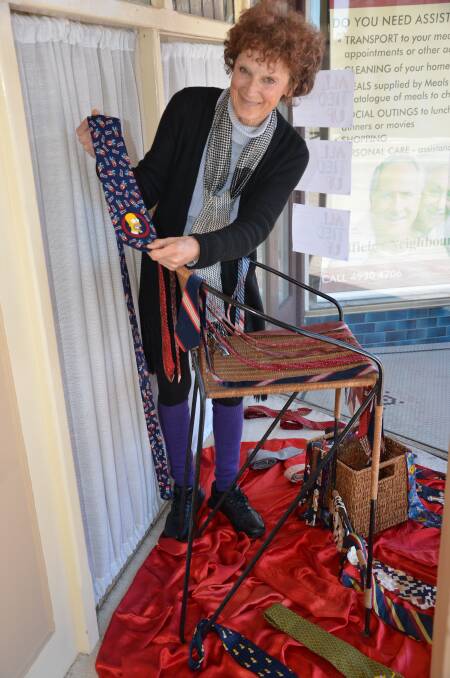 INTERESTING: Australian Museum of Clothing and Textiles volunteer Letitia Plume with the necktie display at 2CHR-FM.